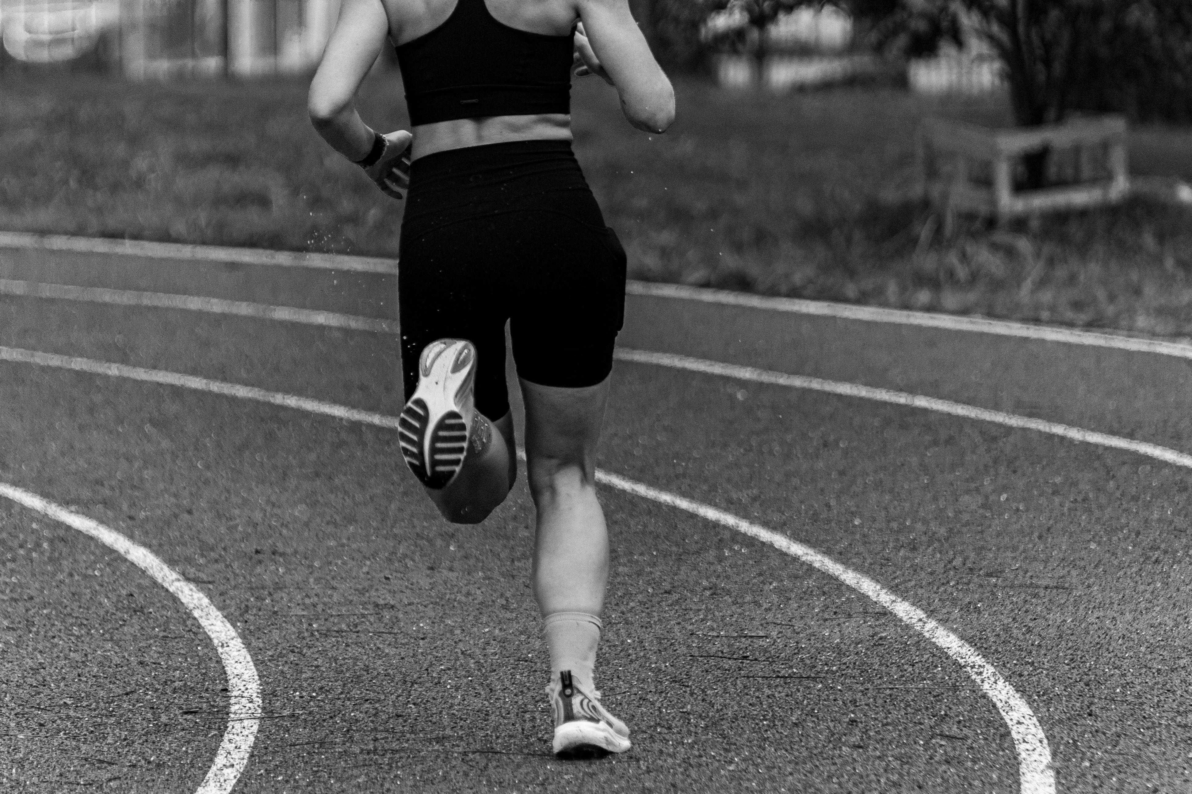 Runner training on a curved athletics track